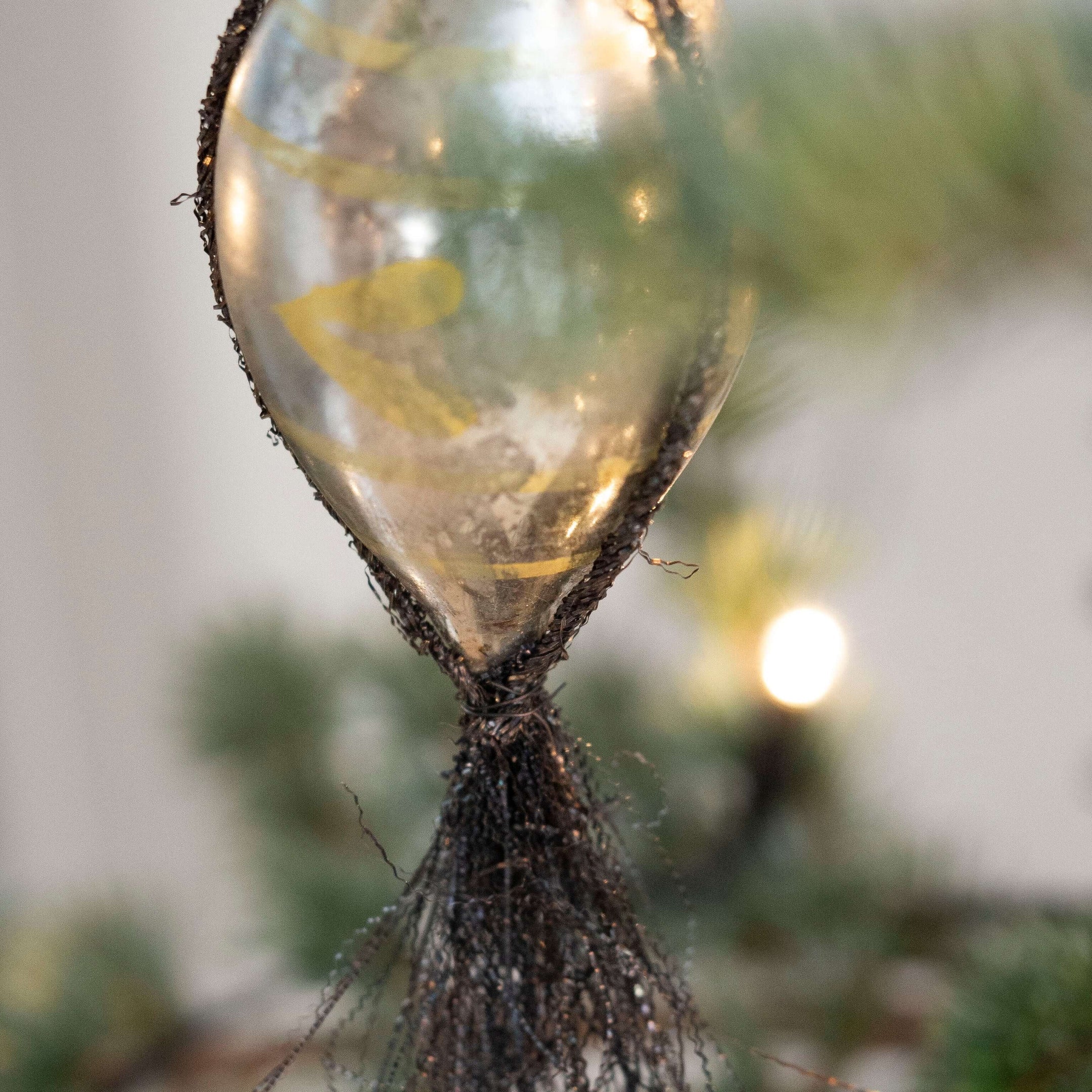 glass-bauble-with-tinsel-and-handprinted-decorations-894767.jpg